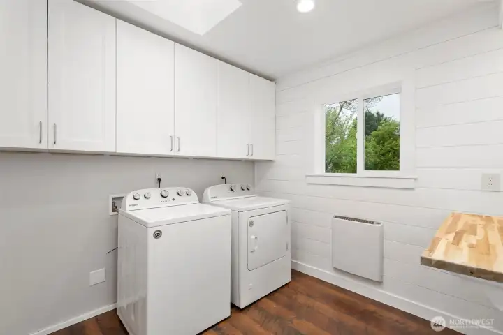 New Laundry addition with folding table and extra storage