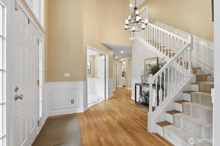 2 story foyer with wainscoting and updated chandelier. 2 story foyer with wainscoting and updated chandelier.