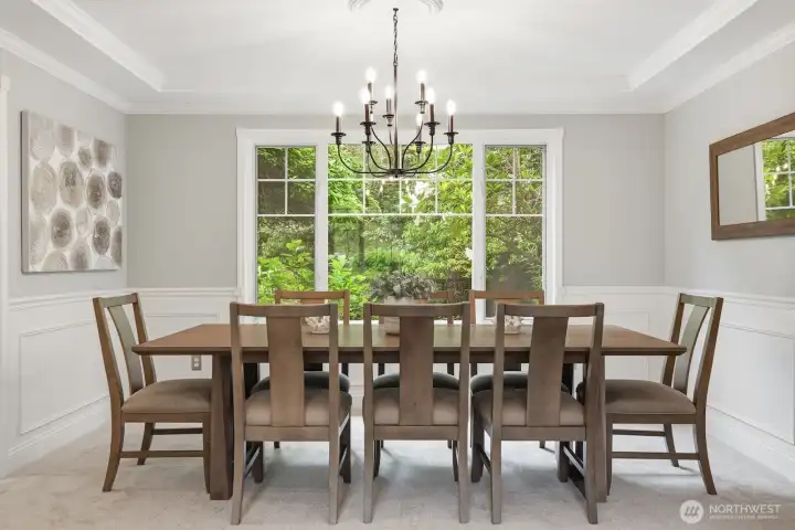 Formal dining room with iron chandelier. Formal dining room with iron chandelier.