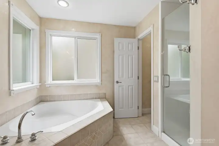 Soaking tub and seamless tiled shower (microbial free, no grout lines). Soaking tub and seamless tiled shower (microbial free, no grout lines).