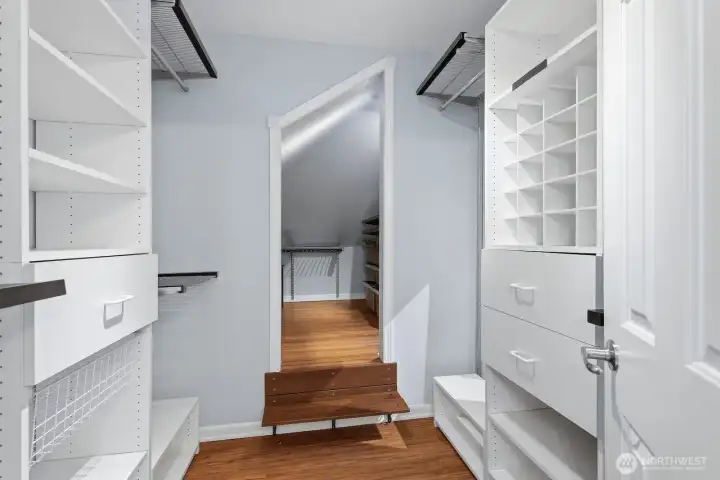 Large walk-in closet with built-ins with an additional extra space. Large walk-in closet with built-ins with an additional extra space.