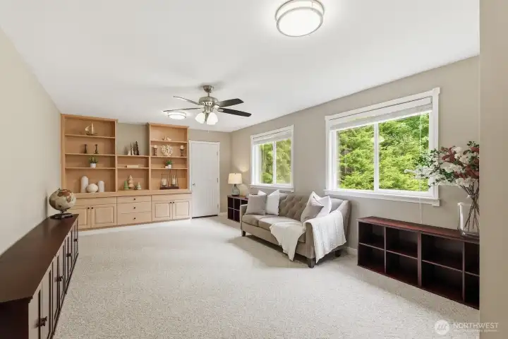 The large bonus room at the end of the hallway with maple built-ins and large storage closet. The large bonus room at the end of the hallway with maple built-ins and large storage closet.
