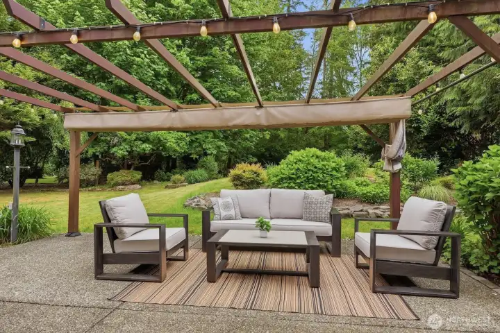 The door off the kitchen lead to the backyard with a large patio with a pergola with retractable roof cover. The door off the kitchen lead to the backyard with a large patio with a pergola with retractable roof cover.