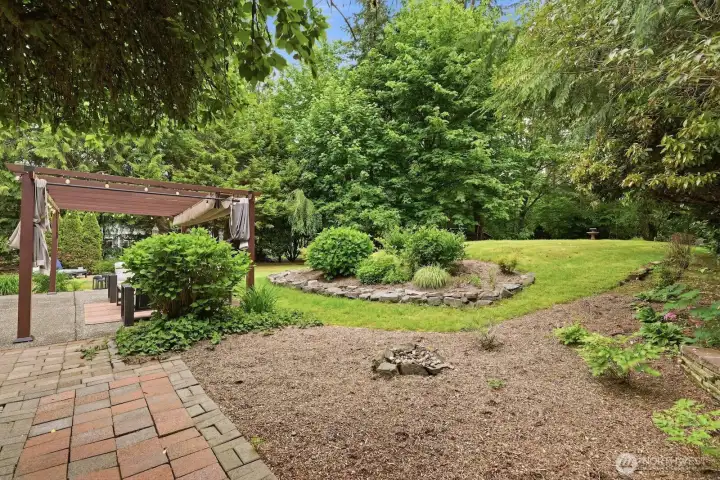 Lush evergreens and garden beds. Lush evergreens and garden beds.