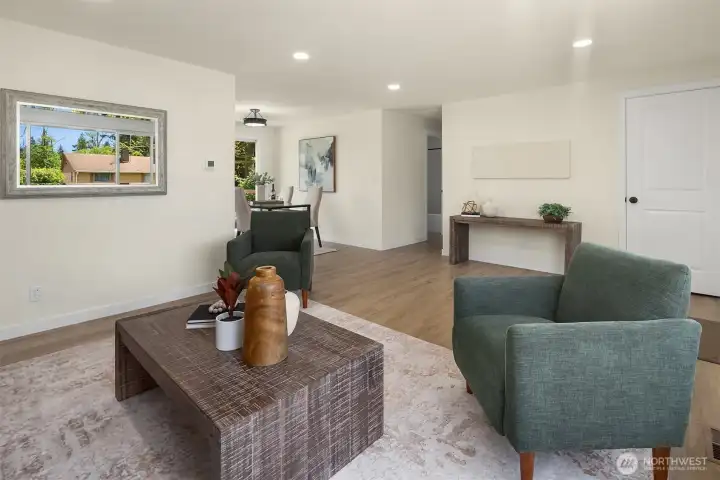 Living room flowing into the updated kitchen with eating space.
