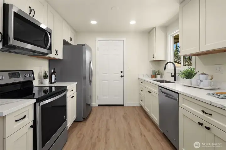 Spacious kitchen with access to garage.