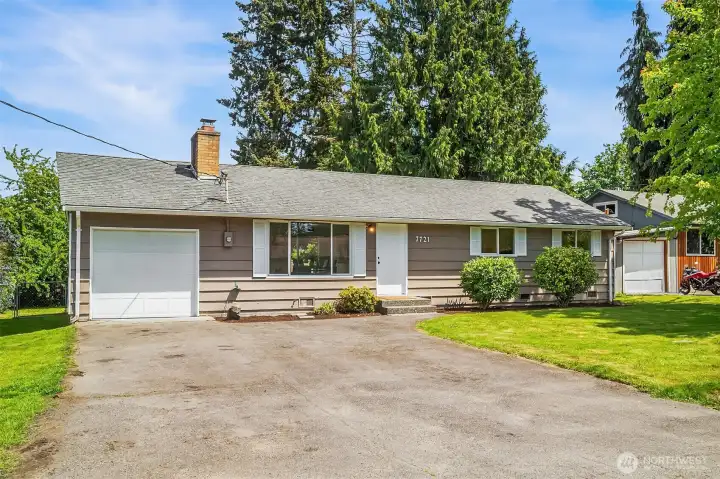 Spacious driveway & frotn yard.