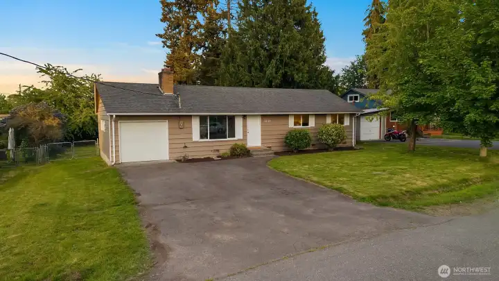 Driveway parking & spacious front yard.