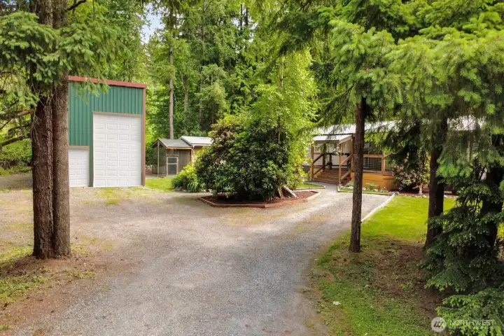 Long private driveway provides convenient access to both the home and detached shop. Seller intends to install the large overhead door prior to closing.Actual appearance may vary until installation is completed.