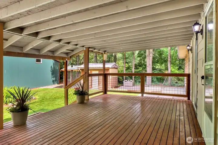 Covered deck creates the perfect space for outdoor dining, entertaining, or relaxing year-round.