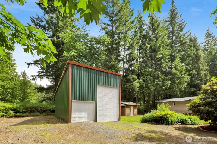 Detached shop offers valuable storage, workshop, or hobby space. Virtually modified imagedepicting the planned large overhead door. Seller intends to install the large overhead door prior to closing.Actual appearance may vary until installation is completed.