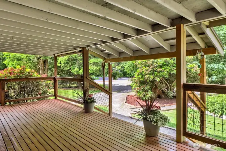 Additional covered outdoor living space extends the home's usable entertaining area.