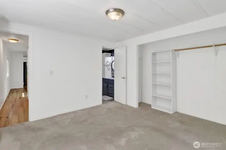 Spacious primary bedroom with flexible layout options and ample wall space.