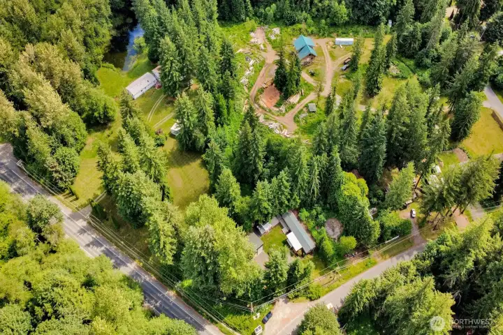 Aerial perspective showcasing the property's private setting and surrounding tree cover