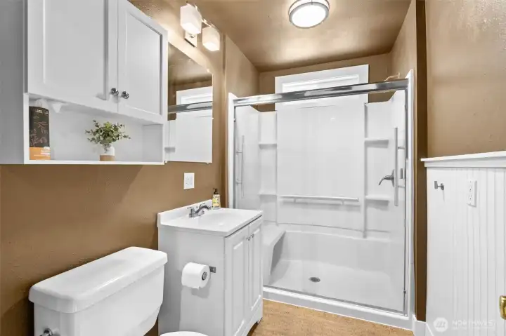 Updated Bathroom room with Wainscoating and an Upgraded Insert! Primary Bathroom on Main Floor for ease!