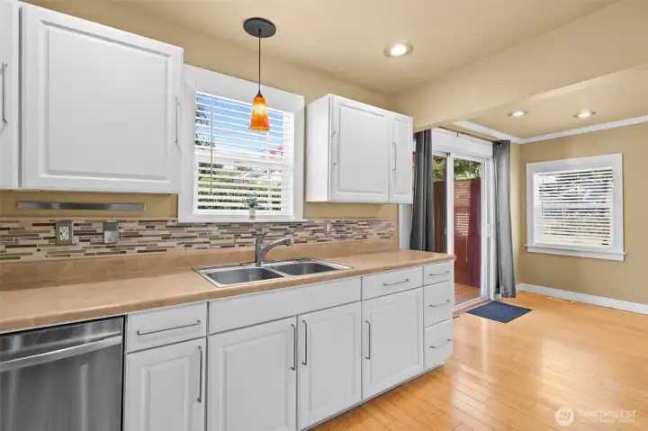 Upgraded Tiled Backsplash! Dont miss the Garbage Disposal and the New Window!