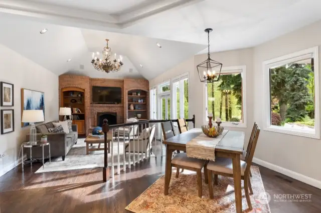 The informal areas include the family room with cathedral ceiling with Antiqued Deco solid iron chandelier; extensive wall of brick surrounds the fireplace flanked by cherry built-ins and French doors leading to the I-Pay deck.