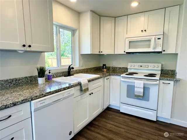 Bright kitchen with granite countertops