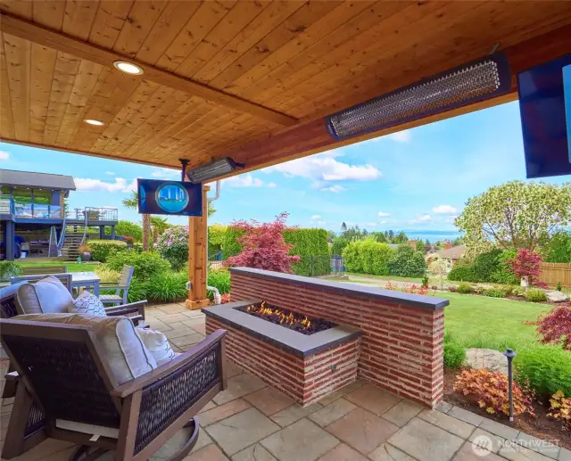 Lower patio with lovely open gas firewall with a view.