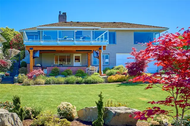 View looking back up at the home, patio and deck.