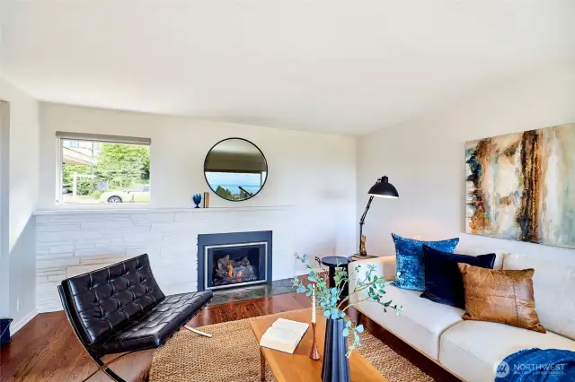 Spacious living room with gas fireplace.