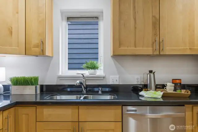 Imagine your next cullinary masterpiece while gazing out the kitchen window that lets the sun in for your herbs!