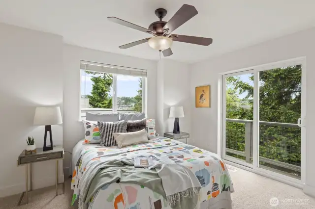 Tucked quietly behind the beautiful trees outside, this primary bedroom includes a fantastic Juliette balcony and large window! The mornings will greet you here!