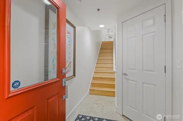 Welcoming you inside is the ground floor foyer with space for shoes and coats, plus direct access to your own private garage!