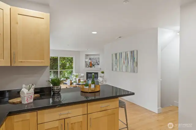 Open to the living spaces, but with just enough separation, this breakfast bar is the perfect spot to sit and feel right at home.