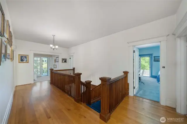 2nd floor landing and view of French doors to balconies