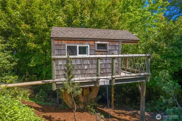 Tree House south of the garage on this .75 acre property