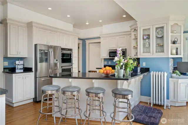 Remodeled Kitchen with custome white cabinets and black granite counters