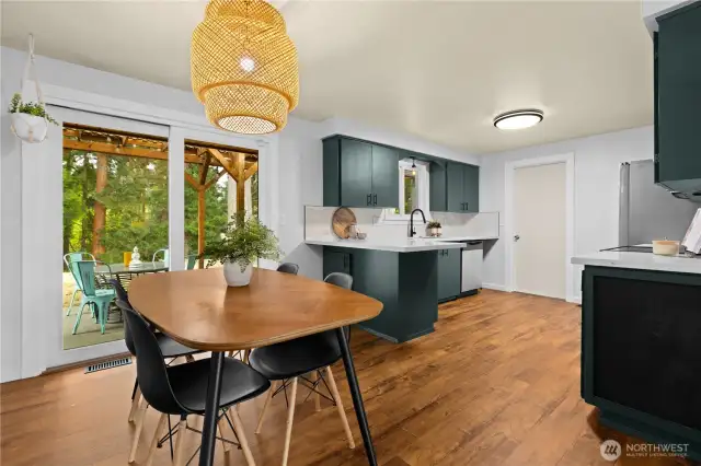 Large dining area with new flooring blends into the open kitchen