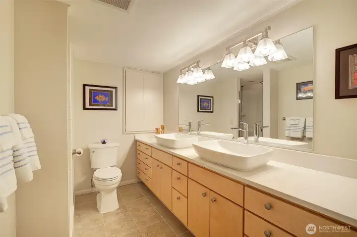 Primary bathroom has new countertops, sinks, toilet and faucets. Heated floors!