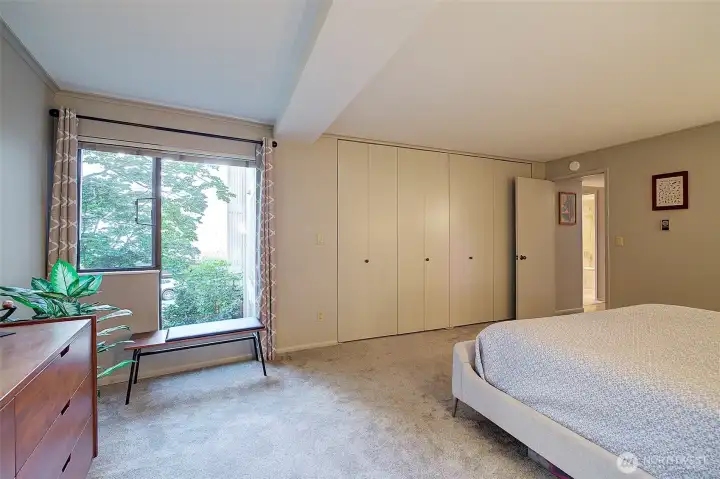 Primary bedroom has view from window.