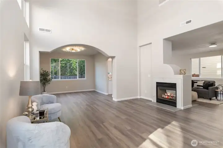 The spacious living area combined with expansive vaulted ceilings creates an attractive and inviting environment.