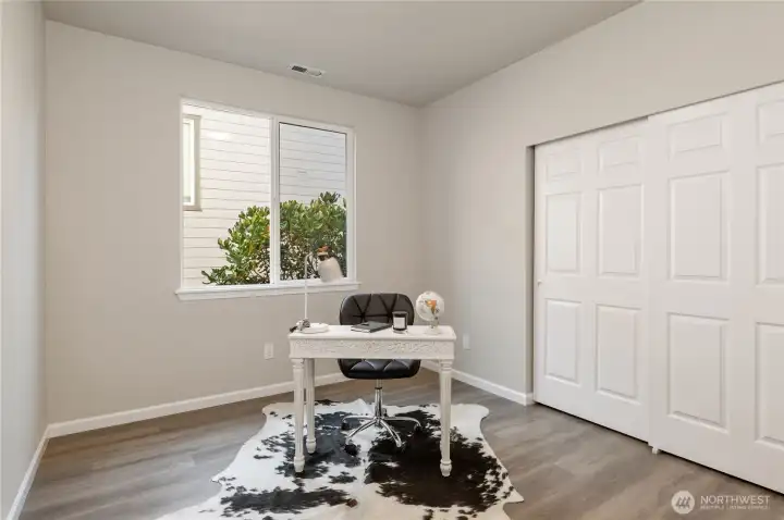 There is a bedroom located on the main level, with a full bathroom situated across the hall.