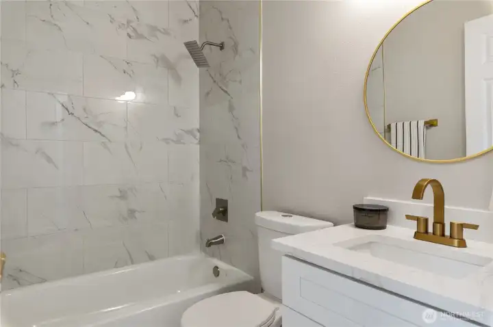 The bathroom has been elegantly renovated and is conveniently located opposite the main floor bedroom.