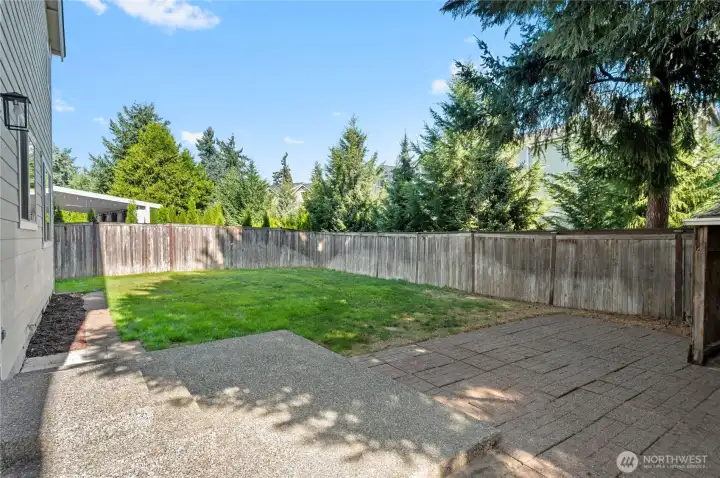 The backyard offers ample space to establish a garden, providing an opportunity to create a personalized outdoor retreat.