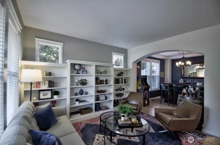 Formal living room with built-in shelving.