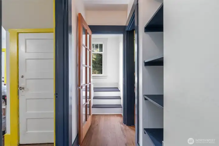 Stairs leading to upper floor Primary Suite.