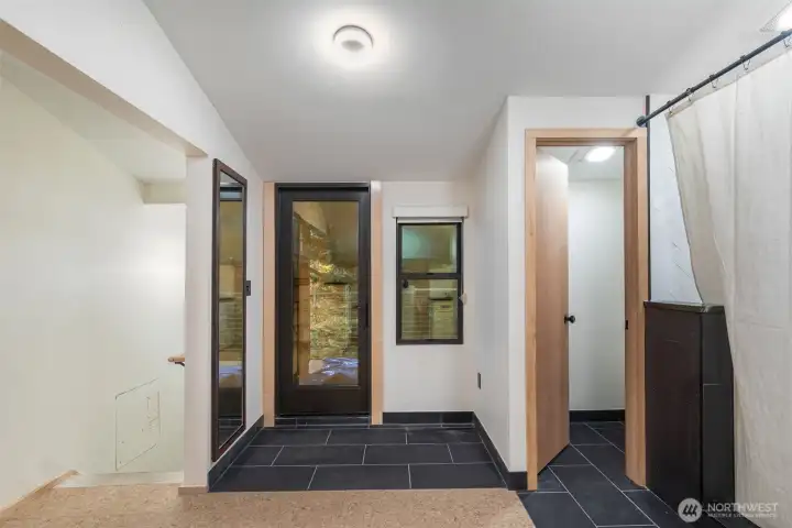 Primary Suite private toilet and door leading to upper deck overlooking the Sanctuary.