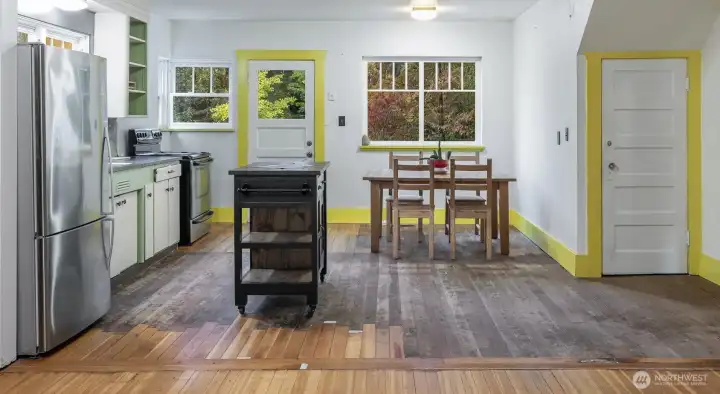 kitchen, awaiting renewal. Door to right leads to lower level basement.Potential for deck out backdoor or close in for maximum use of space.