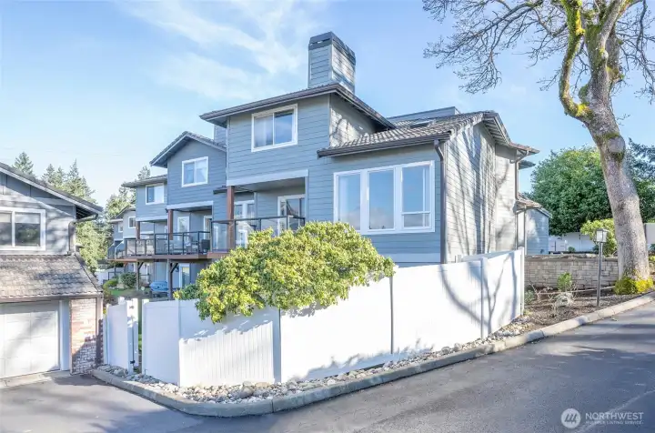 Enjoy the privacy of a rear-facing condo with its own yard and a gated walkway providing easy access to the shared dock on Lake Steilacoom.