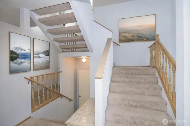 Stairway connecting the main level to the upper and lower levels.