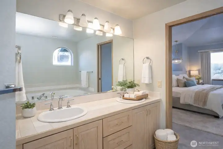 Another perspective of the primary ensuite with a wall-to-wall mirror.