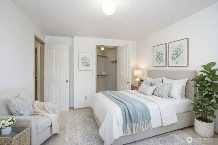 Upper-level first guest suite with generous walk-in closet.