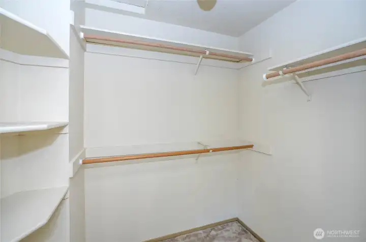 Generous walk-in closet for the first guest suite.