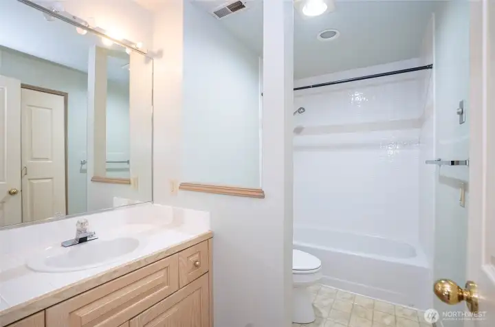 Well-appointed full bath for upper-level guests.