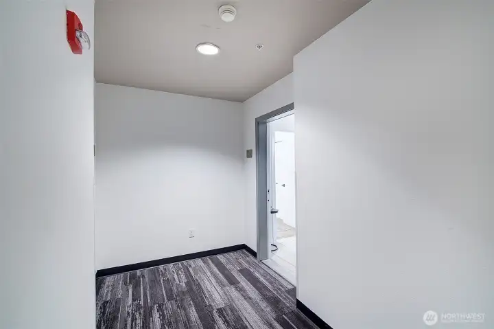 Peaceful and quiet living at the end of the hallway. means.